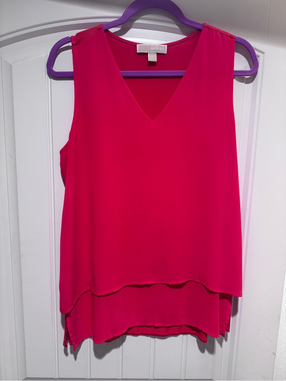 Michael Kors Sleeveless V-Neck Layered Camisole in orange.